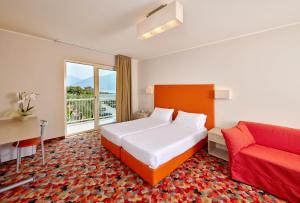 Postel nebo postele na pokoji v ubytování Hotel Royal Village