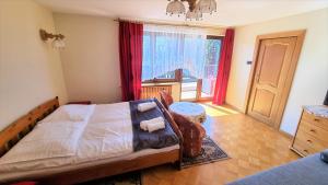 Posteľ alebo postele v izbe v ubytovaní Willa Tadeusz Zakopane