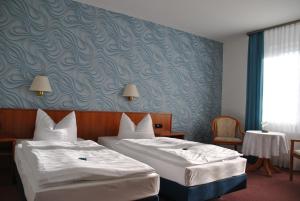 Postel nebo postele na pokoji v ubytování Hotel Pesterwitzer Siegel + 33 fotografií