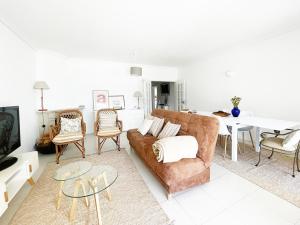 a living room with a couch and a table at CC - Casa da Costa in Costa Nova