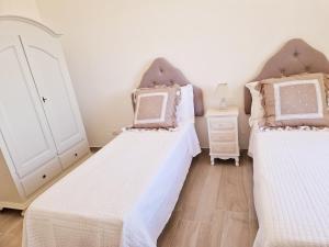 A bed or beds in a room at Villa Anna holiday house