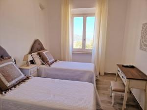 A bed or beds in a room at Villa Anna holiday house