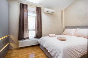 Postel nebo postele na pokoji v ubytování Apartment Leonardo