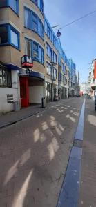 an empty street in a city with a building at IRU, not for parties, not a hotel, room with no kitchen in Amsterdam