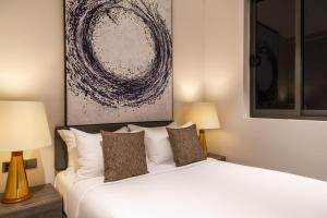 Llit o llits en una habitació de Crystal Sands Hikkaduwa