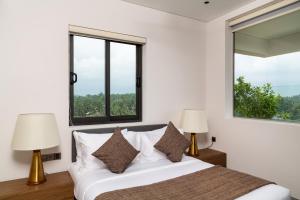 Llit o llits en una habitació de Crystal Sands Hikkaduwa