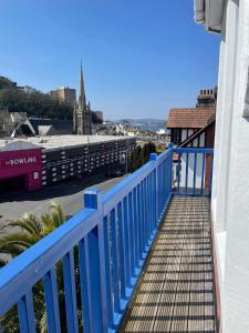 a blue railing on the side of a building at Hotel Hudson in Torquay