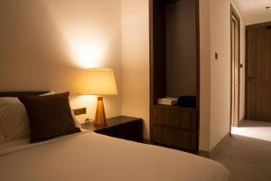 Llit o llits en una habitació de Crystal Sands Hikkaduwa