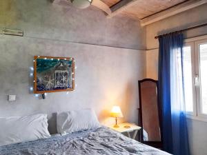 Posteľ alebo postele v izbe v ubytovaní Corfu Town Garden Cottage