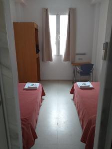 Postel nebo postele na pokoji v ubytování Albergue Inturjoven Córdoba