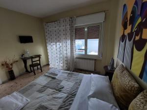 Postel nebo postele na pokoji v ubytování B&B Il MappaMondo