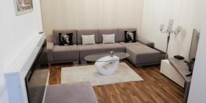 a living room with a couch and a table at Oliver apartmán 6 in Štrbské Pleso