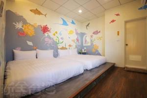 Giường trong phòng chung tại Lu Dao Homestay