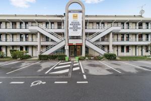an empty parking lot in front of a building at Première Classe Lille Sud Henin Beaumont in Noyelles-Godault