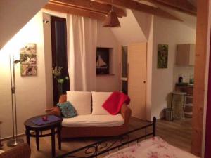 a living room with a couch and a table at Ferienwohnungen "Vieling" Objekt-ID 12155-9 in Waren