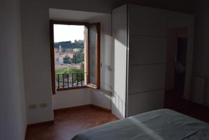 Ένα ή περισσότερα κρεβάτια σε δωμάτιο στο Appartamento Ansidei 3 +27 φωτογραφίες