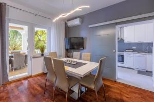 a kitchen and dining room with a table and chairs at Apartment Villa Zdenka in Crikvenica