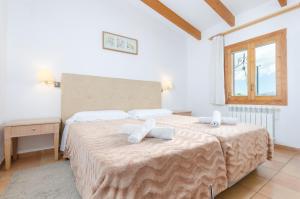 Postel nebo postele na pokoji v ubytování YourHouse Sa Cova Dor + 36 fotografií