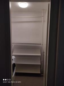 an empty refrigerator with a light in a room at Ricky-Lerua casa vacanze in Florence