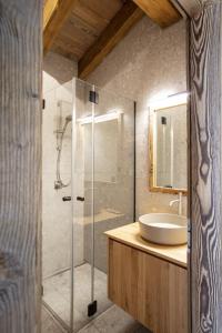 a bathroom with a glass shower and a sink at Polaris 1 006 - LUXE & SKI LIFT apartment 6 pers in Zinal +27 photos