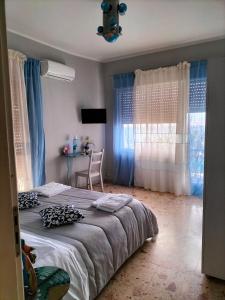 Postel nebo postele na pokoji v ubytování B&B Il MappaMondo