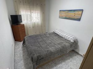Posteľ alebo postele v izbe v ubytovaní PRECIOSA CASA CON PISCINA AL LADO DE LA PLAYA