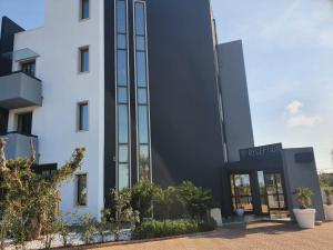 a building with a black and white facade at Tuo Hotel in Polignano a Mare