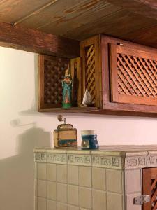 a kitchen counter with a wooden cabinet and a shelf at Ferienhaus Insel Murter Vivaldi/Stonehouse Betina in Betina