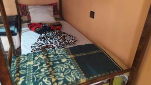 Rúm í herbergi á Kasbah Red Castel Hostel