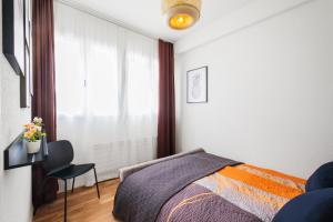 Voodi või voodid majutusasutuse Spirit Apartments - Zentral am See - Parkplatz toas