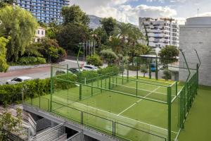 a tennis court on top of a building at Royal Savoy - Ocean Resort - Savoy Signature in Funchal