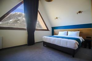Llit o llits en una habitació de Suatis Resort Kazbegi