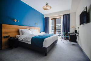 Una cama o camas en una habitación de Suatis Resort Kazbegi