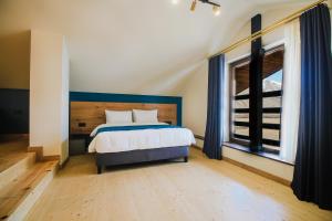 Llit o llits en una habitació de Suatis Resort Kazbegi