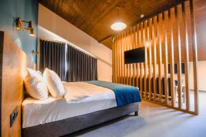 Llit o llits en una habitació de Suatis Resort Kazbegi