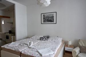 Postel nebo postele na pokoji v ubytování Krejčovství