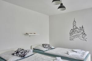 Postel nebo postele na pokoji v ubytování Krejčovství