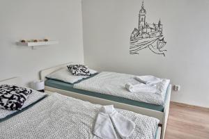 Postel nebo postele na pokoji v ubytování Krejčovství