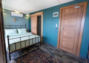 A bed or beds in a room at Liman Deluxe Hotel