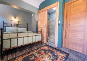 A bed or beds in a room at Liman Deluxe Hotel