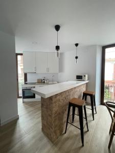 Kuchyň nebo kuchyňský kout v ubytování Carmela Apartment.