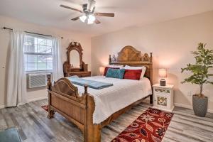 a bedroom with a bed and a ceiling fan at Family-Friendly Condo about 3 Mi to Branson Landing in Branson +34 photos