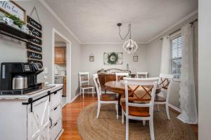 a kitchen and dining room with a table and chairs at Single-Story Manchester Home Close to Parks! in Manchester