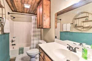 a bathroom with a sink and a toilet at Charming Burnet Cottage with Lake View and Porch! in Burnet +23 photos
