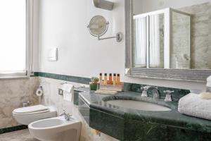 Koupelna v ubytování Residenza Parco Fellini