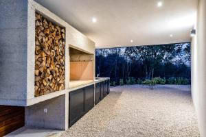 a room with a wall filled with fire wood at Villa Larra in Gostinjac