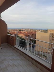 a balcony with a view of a city at Open house in Campofelice di Roccella