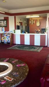 a lobby with a counter in a hotel room at Village Inn Salina in Salina