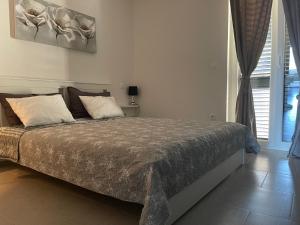 Posteľ alebo postele v izbe v ubytovaní Villa Nika & Eva