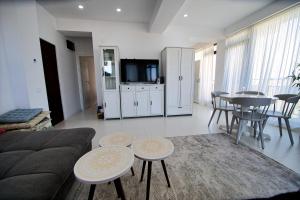 a living room with a couch and a table at Stef by Loft Oxygen in Jupiter